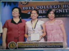 Jancy displays her medal and certificate. Also in the picture are her mother (R) and Dr. Fely Chin (L), vice president  for Academic Affairs 